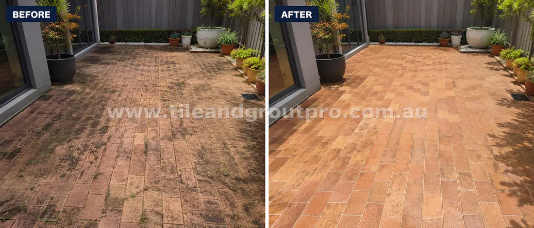 Before tile renewal, clay brick pavers in a residential courtyard patio showed dark staining, weed growth in joints, surface grime, and uneven colouring around landscaped garden pots.