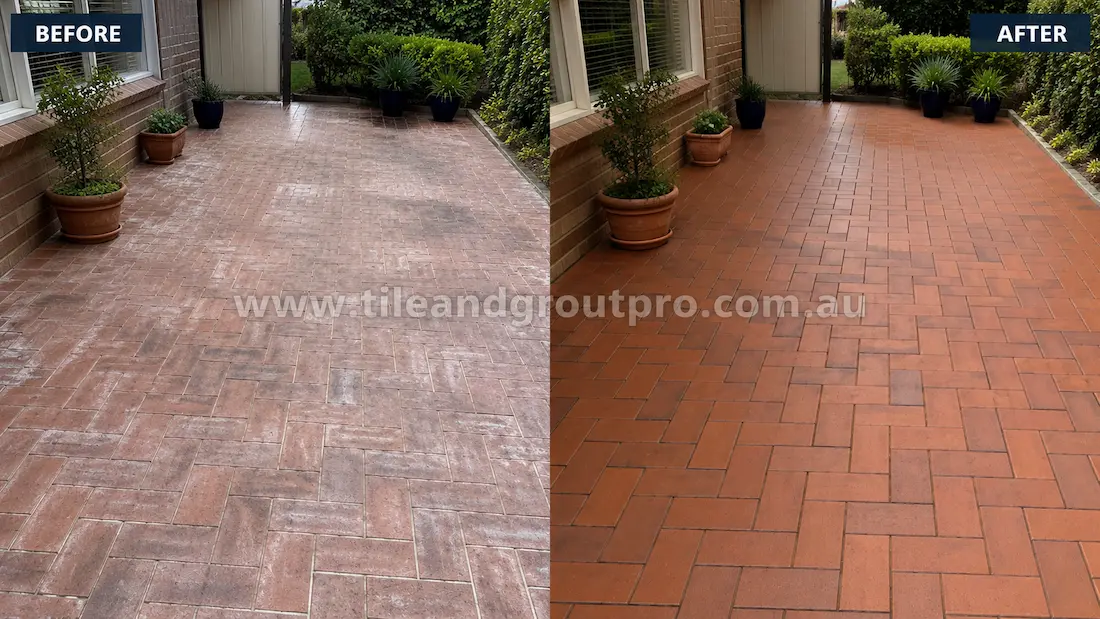 Before tile renewal, herringbone-pattern clay brick pavers in a residential courtyard displayed efflorescence, weathering, surface discolouration, and accumulated dirt between the joints.