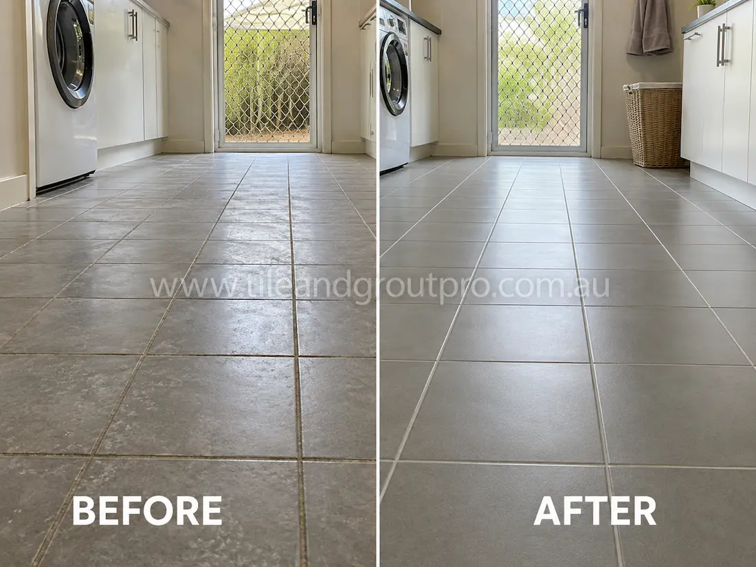Laundry room with grey ceramic floor tiles before sealer stripping, displaying faded surface finish and visible sealer haze near appliances and exterior door access.