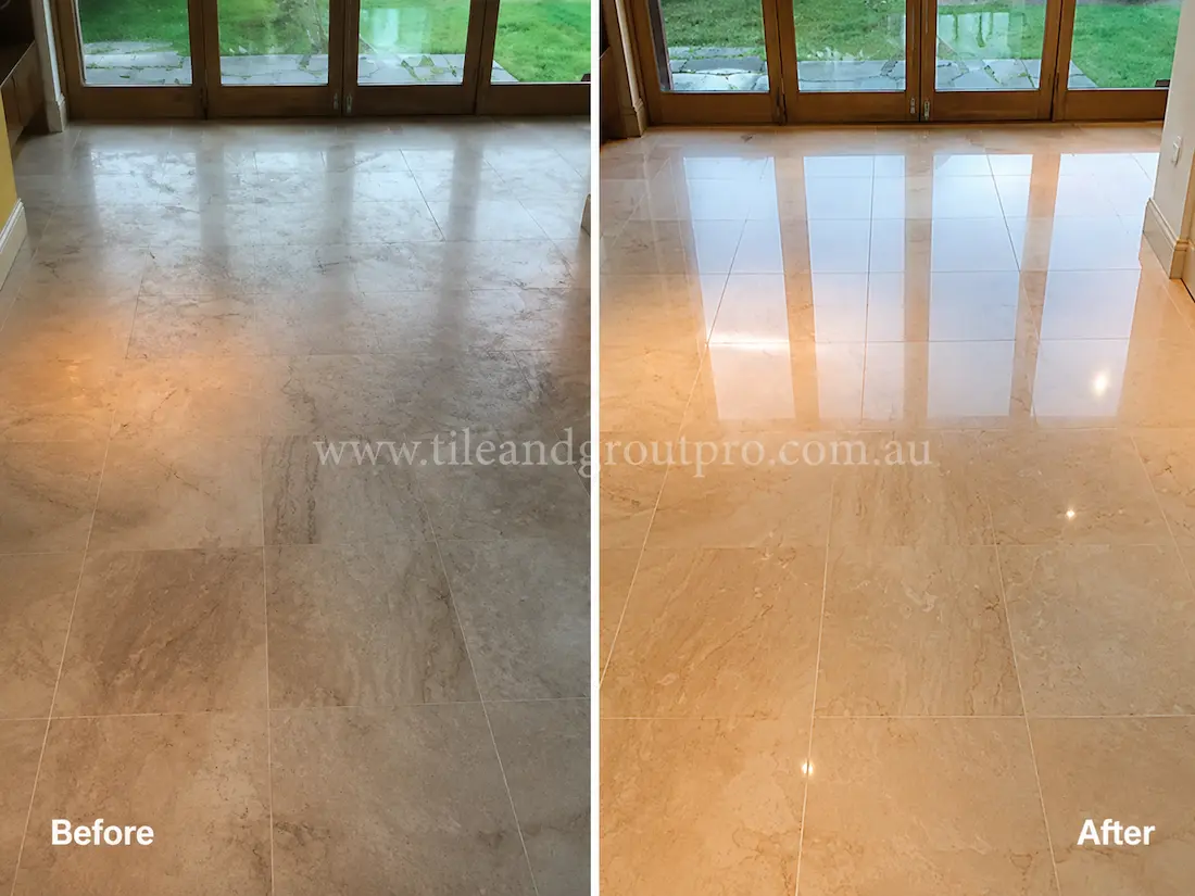 Before tile renewal, the indoor travertine floor tiles had dull patches, light etching, and reduced shine near large glass doors in a living area.