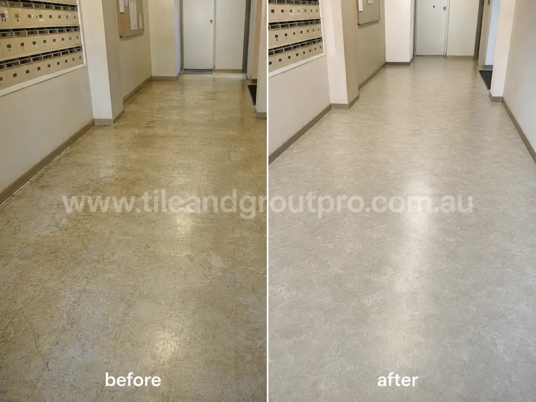 Apartment lobby corridor with beige linoleum floors before sealer stripping, showing discoloration, scuff marks, worn finish, and aged sealer near mailboxes and entryways.