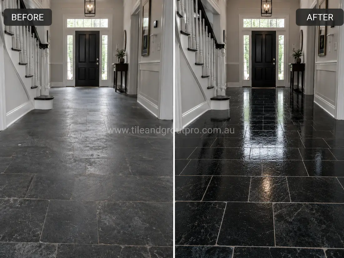 Before stone polishing, the black bluestone foyer entrance floor had a cloudy, dull finish with reduced reflectivity and visible traffic wear in a bright residential hallway.