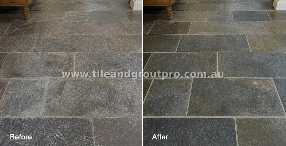 Rectangular bluestone natural stone tiles showing grime accumulation, surface haze, and stained grout lines before professional tile and grout cleaning