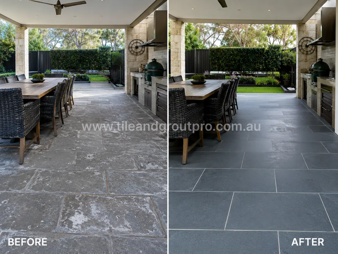 Covered outdoor bluestone patio tiles before grinding, displaying faded stone surfaces, light staining, and weather exposure in an alfresco dining and barbecue area.