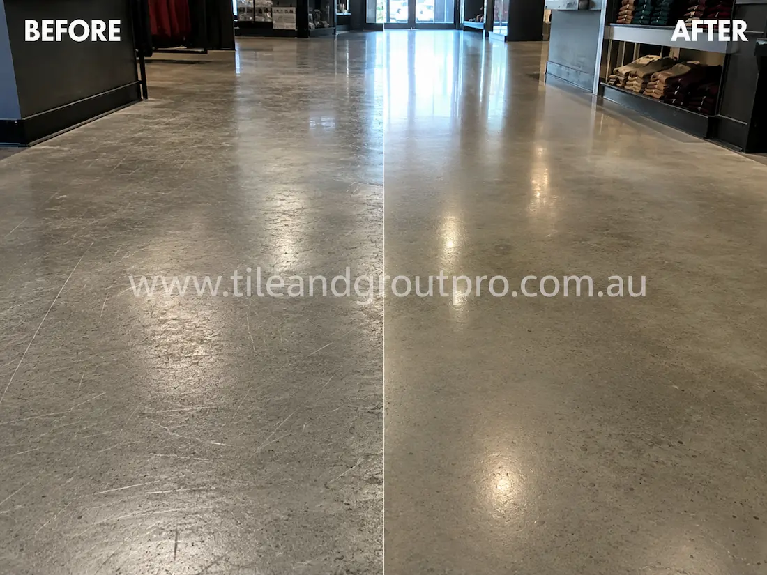 Retail store polished concrete floor with noticeable scratches, scuffing, and worn surface finish before scratch removal and concrete polishing service.