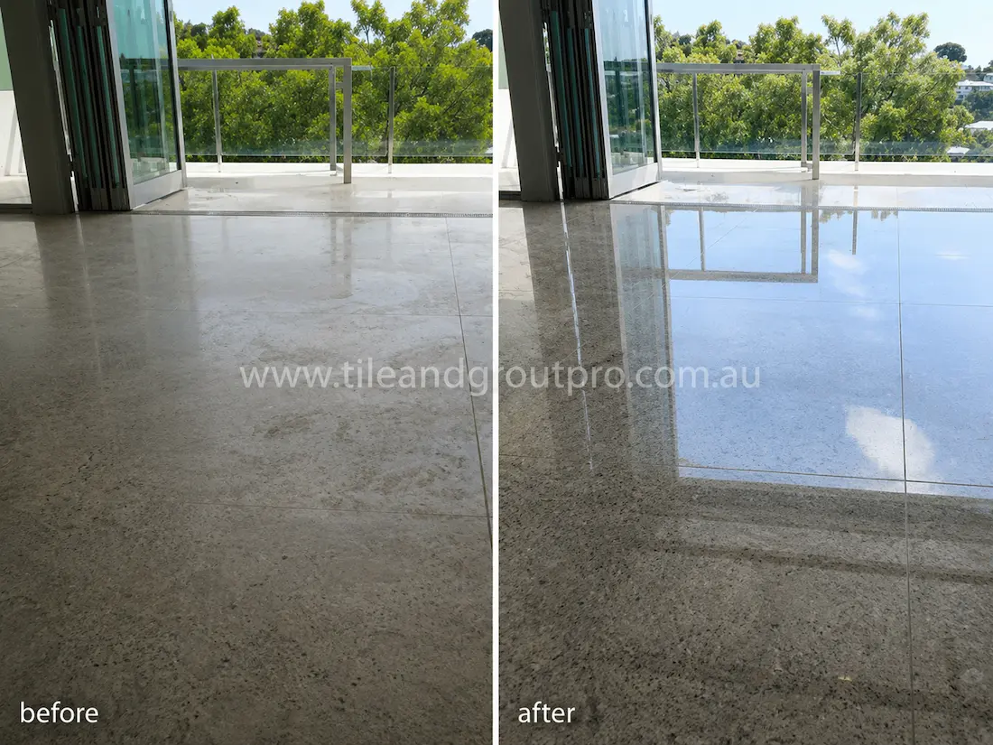 Before tile renewal, the polished granite balcony floor tiles appeared hazy and worn with low shine in the indoor-outdoor apartment living area.