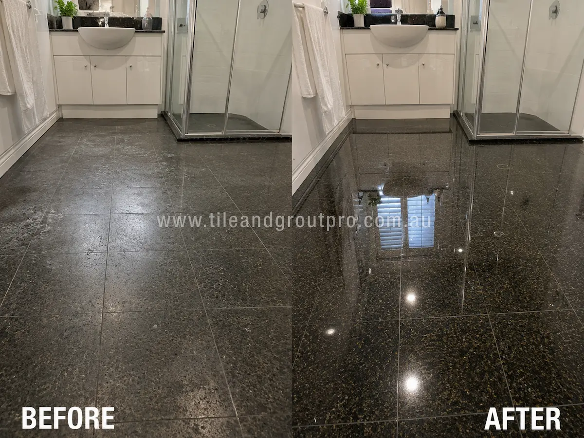 Before-and-after comparison of black granite bathroom floor tiles with dull sealer buildup, patchy finish, and reduced shine before Sealer Stripping. 