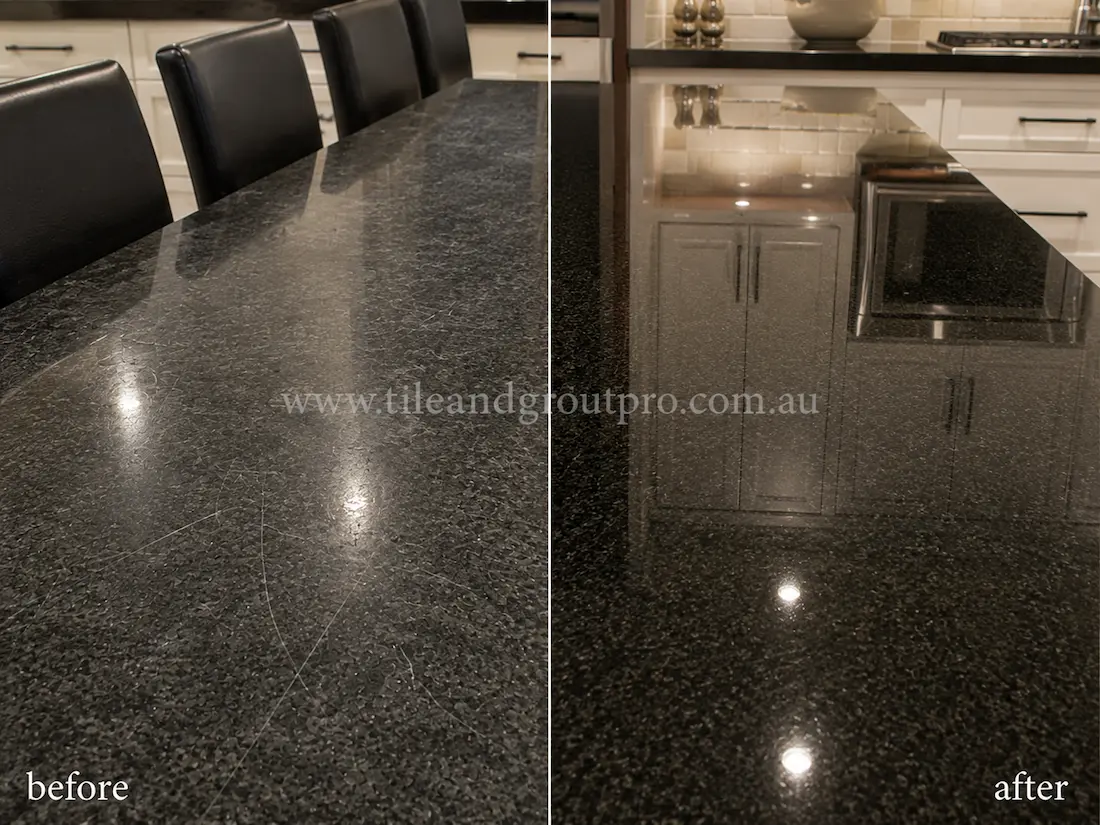 Black granite dining countertop with visible scratches before scratch removal, restored to a polished reflective stone surface in a modern kitchen setting.