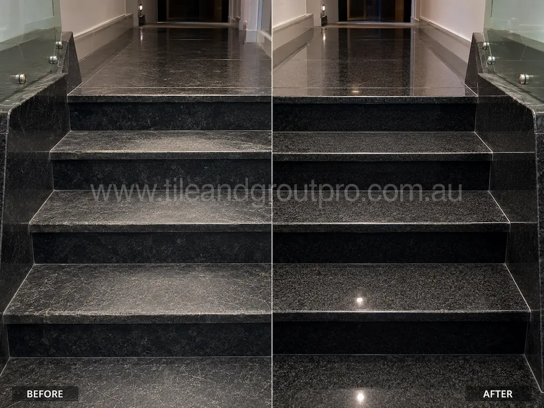 Indoor black granite staircase before grinding, displaying dull stone steps, surface scuffs, and faded polish in the residential hallway.