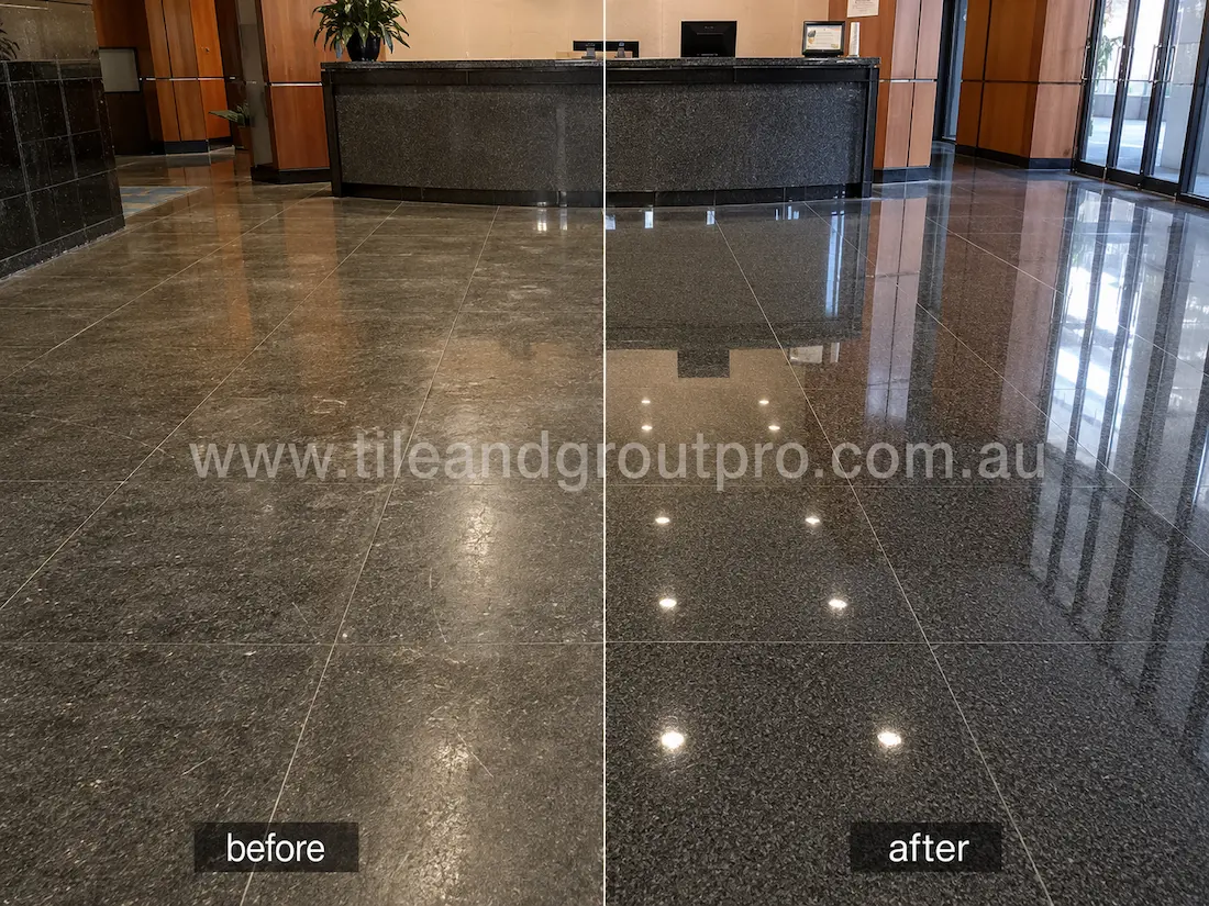 Commercial lobby black granite floor before grinding, featuring worn polished stone tiles, visible haze, scratches, and reduced shine around the reception area.