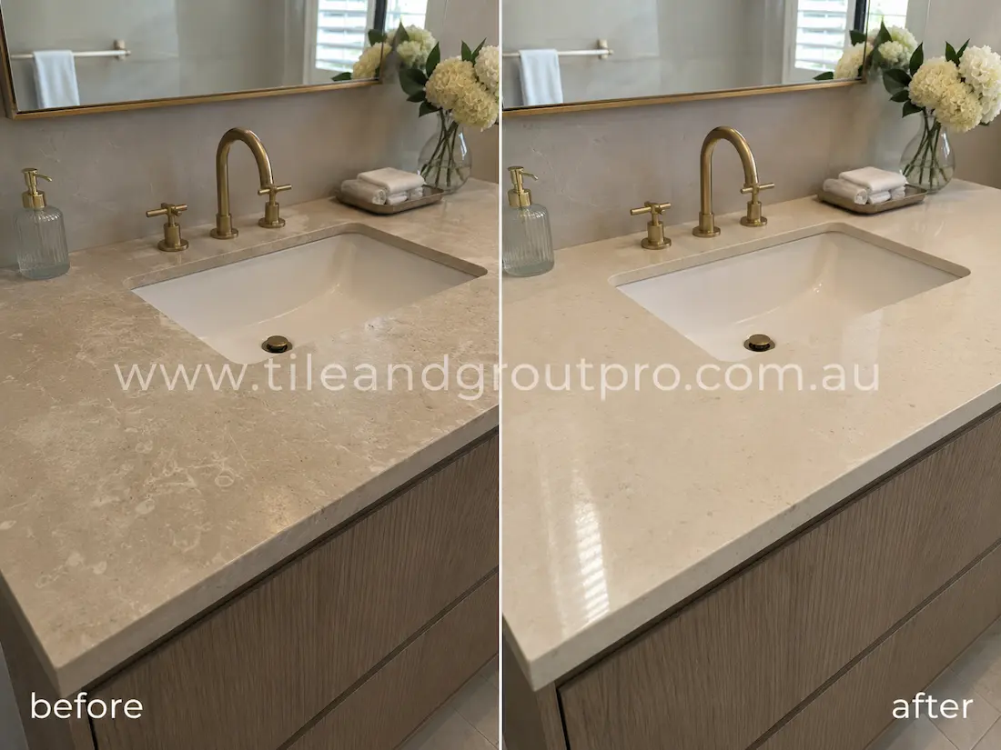 Bathroom limestone vanity benchtop before grinding, featuring water etching, cloudy finish, light scratches, and worn polish around the sink and tap fixtures.