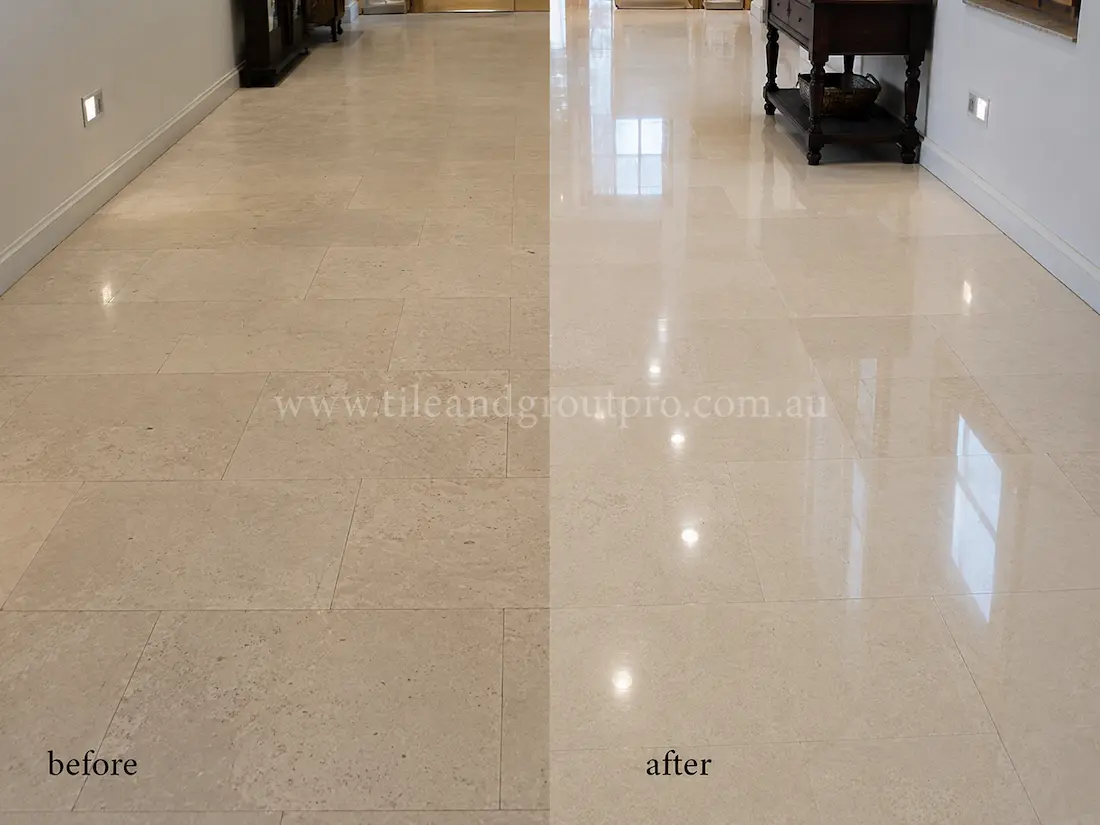 Beige limestone hallway floor tiles with a dull, low-reflective finish before professional stone polishing in a residential interior corridor.