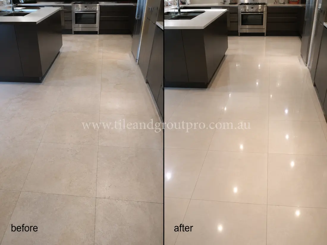 Cream limestone kitchen floor tiles with worn matte appearance and minimal shine before professional stone polishing.