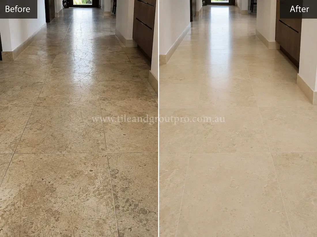 Residential hallway with cream limestone floor tiles showing scratching, etching, and a worn matte appearance before tile resurfacing and polishing.