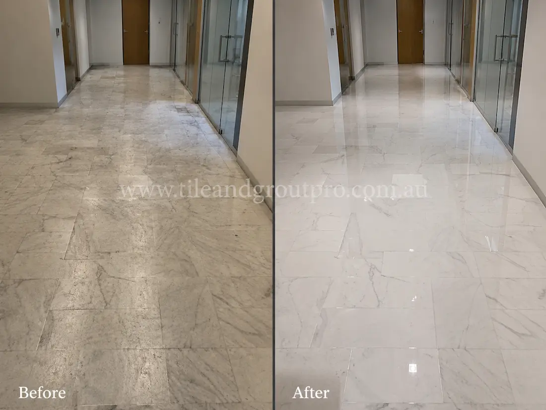 Before tile renewal, the commercial marble corridor floor tiles appeared worn and hazy with traffic marks and low reflectivity in an office hallway.