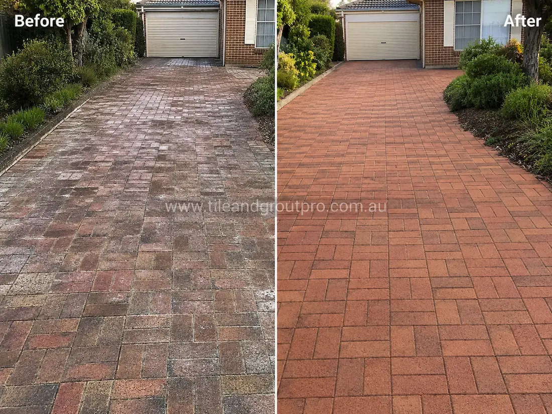 Residential driveway with brick pavers before sealer stripping, displaying white sealer residue, faded red colouring, and uneven weathered surfaces leading to the garage entrance.