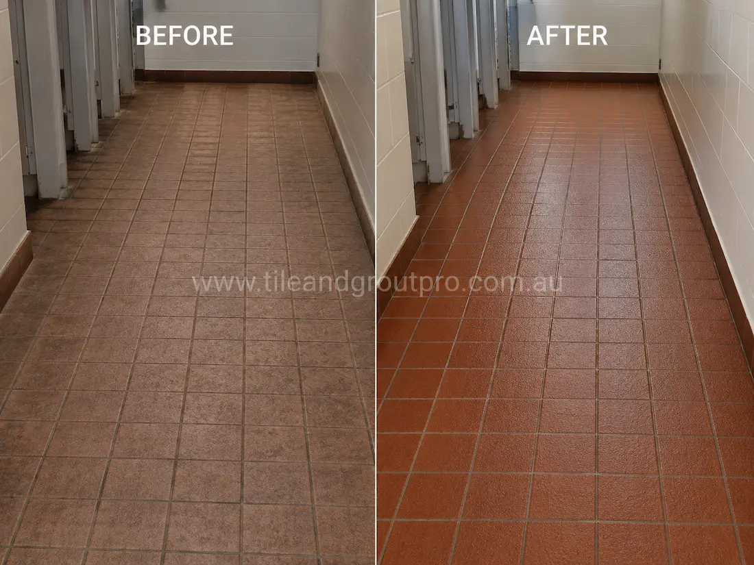 Before tile renewal, quarry floor tiles in a commercial facility hallway appeared worn and faded with traffic marks, surface staining, and darkened grout in a high-use corridor.
