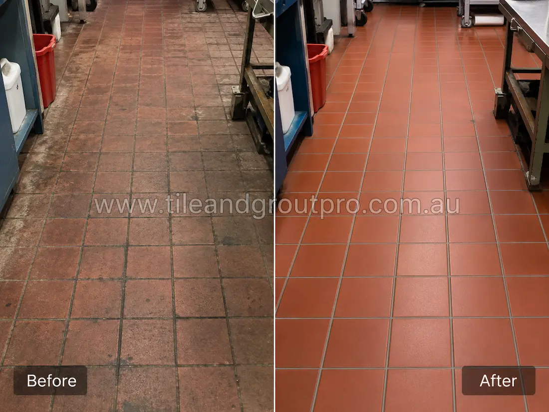 Before tile renewal, red quarry tiles in a commercial kitchen displayed grease buildup, staining, worn sealant, and darkened grout in a high-use food preparation area.