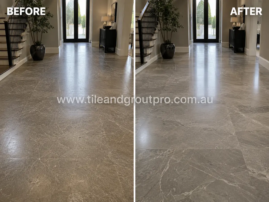Luxury residential entryway with polished grey quartzite floor tiles displaying fine scratches, dullness, and traffic wear before quartzite scratch removal and restoration.