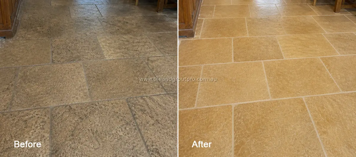 Close-up of textured sandstone floor tiles with dirt buildup, discoloration, and worn grout joints before tile and grout cleaning