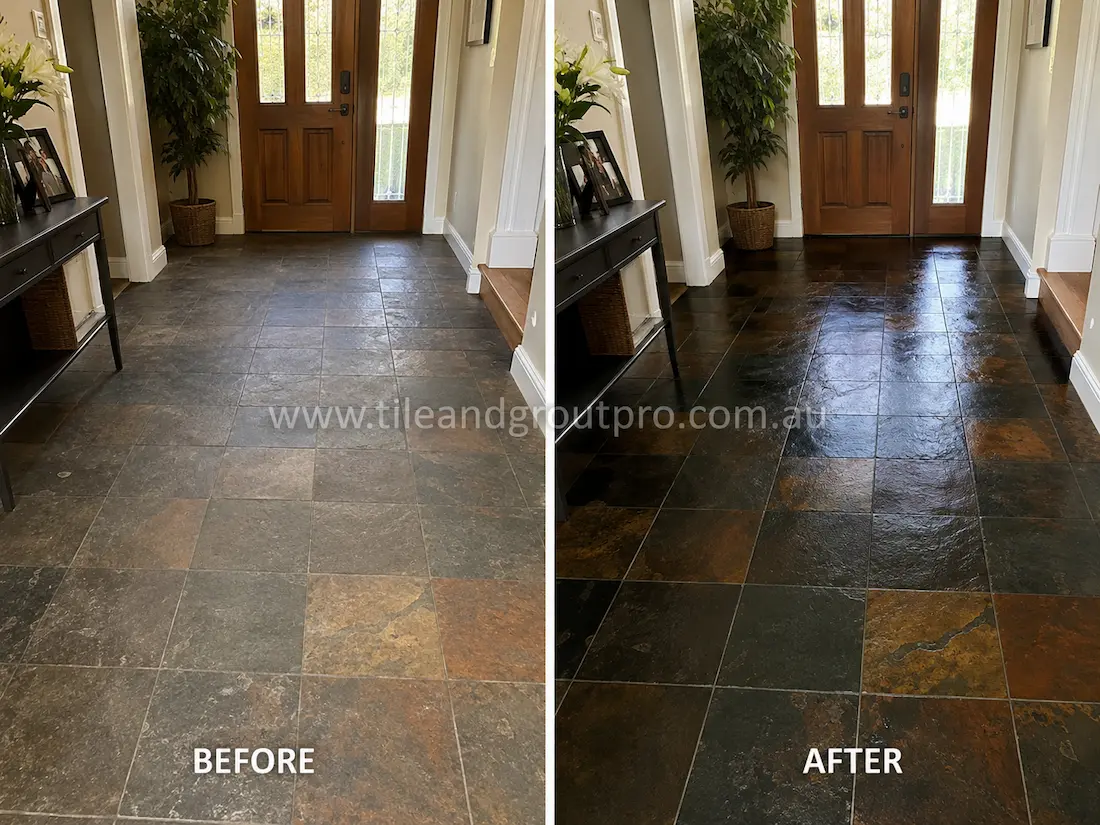 Before stone-polishing of natural slate floor tiles in a residential entryway with dull, faded surfaces, muted rust tones, and visible wear near the timber front door.