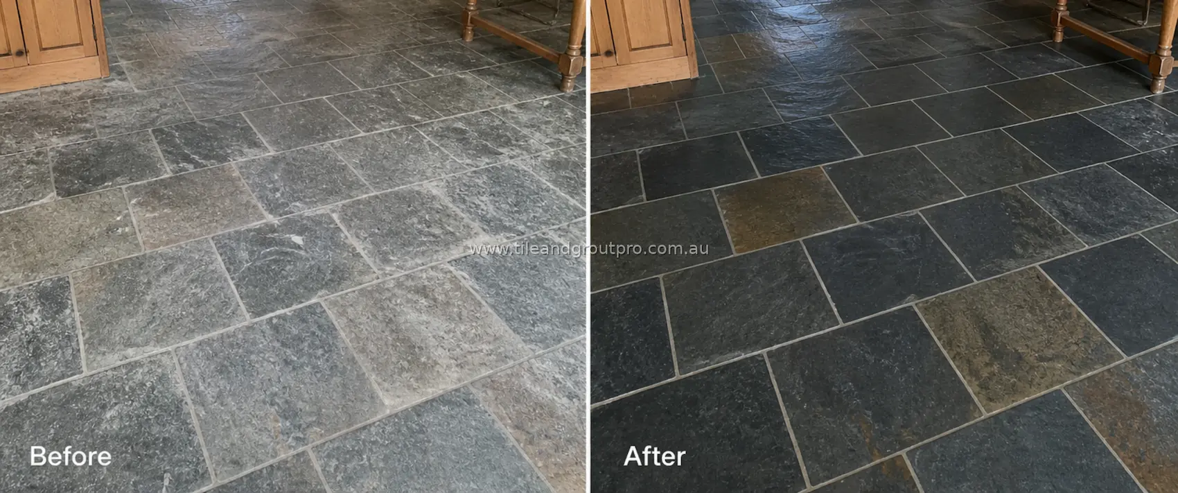 Slate natural stone floor tiles in a kitchen area with heavy residue, haze, and uneven discoloration across the surface before tile and grout cleaning