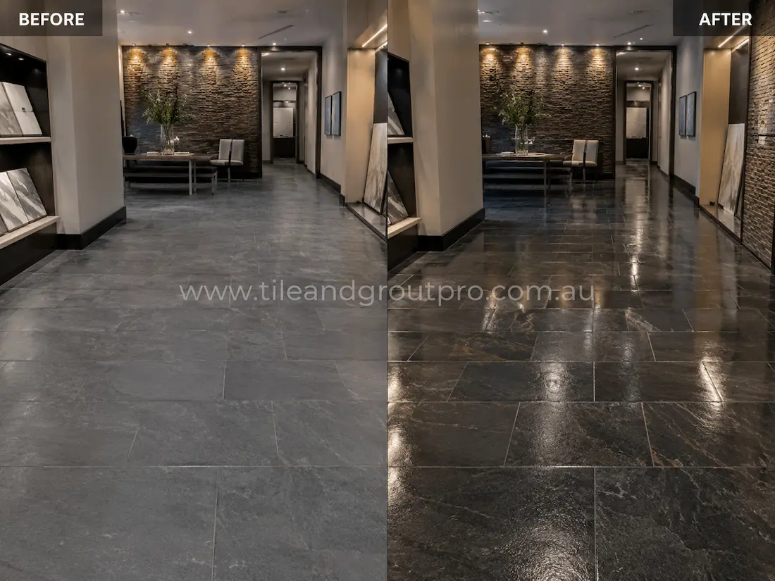 Before stone-polishing of natural slate flooring in a modern showroom corridor with matte stone surfaces, light scuffing, and uneven colour tones under interior lighting.