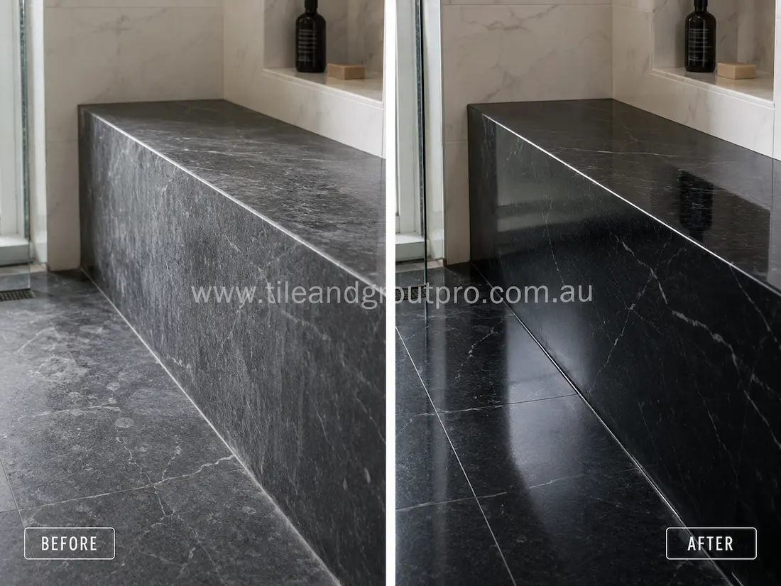 Before-and-after stone polishing of a soapstone bathroom countertop, showing cloudy, faded surface before polishing and a smooth, rich dark surface after.