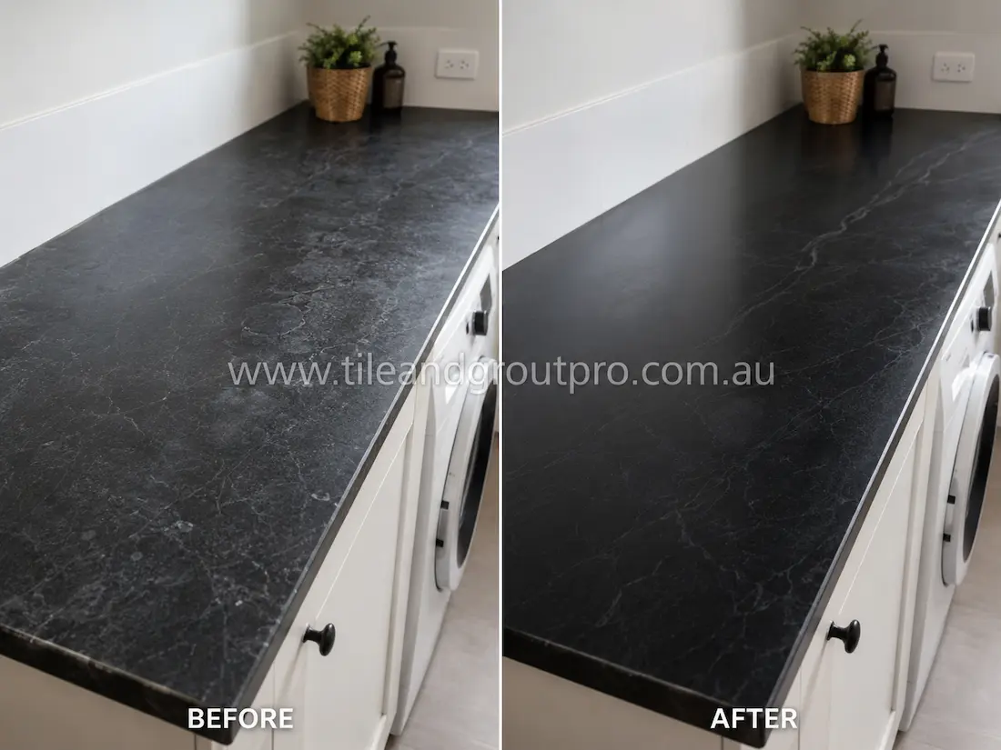Before stone-polishing, the soapstone laundry countertop showed cloudy patches, minor scratches, and a worn matte finish beside the washing machine area.