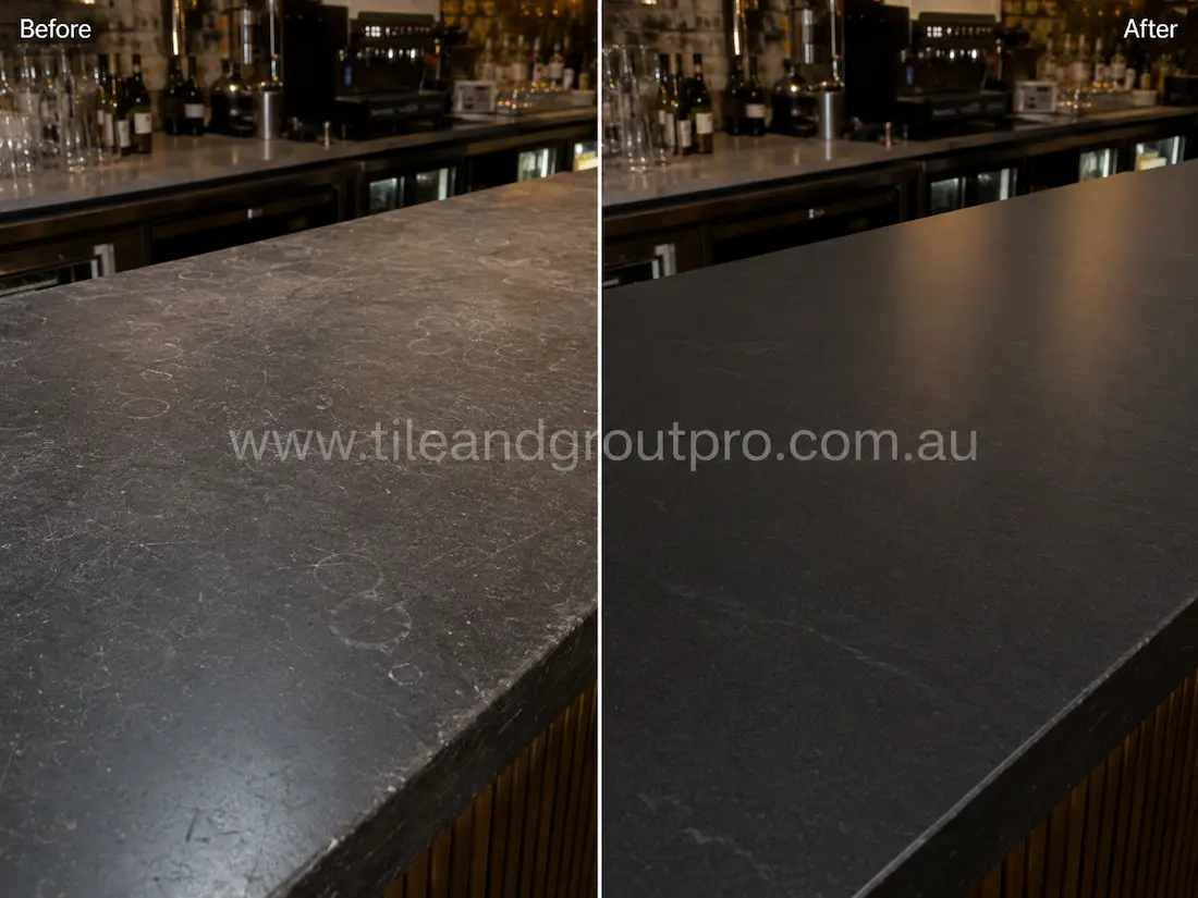 Before and after tile resurfacing of a soapstone-look commercial bar countertop, showing ring marks, scratches and surface wear restored to a smooth matte black finish while retaining subtle natural veining.
