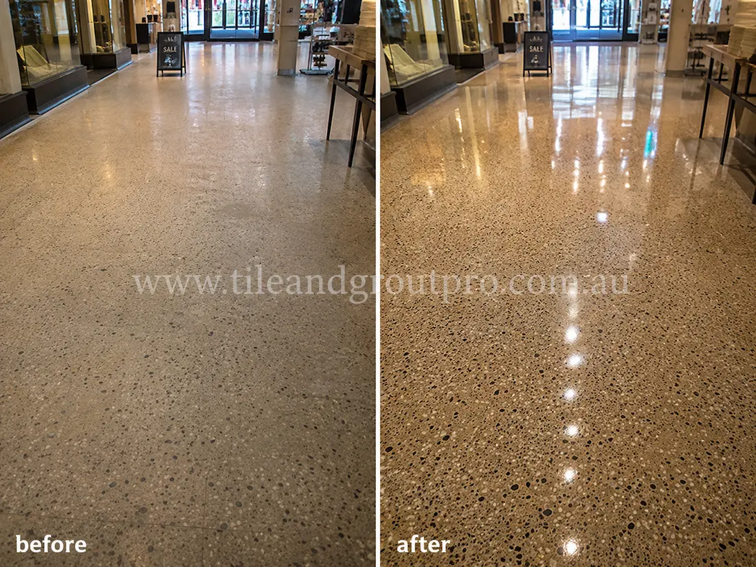 Before tile renewal, the retail terrazzo floor showed heavy foot-traffic wear, cloudy polishing, and reduced gloss throughout the shopping area.