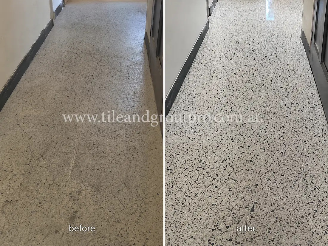 Residential hallway with terrazzo flooring affected by dullness, scuff marks, and worn surface appearance before professional terrazzo tile resurfacing.