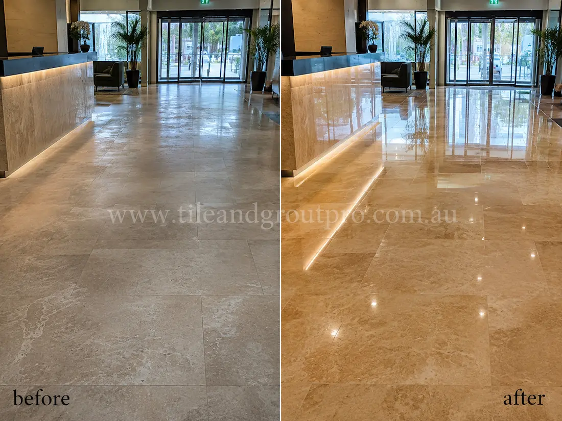 Before stone polishing, the commercial lobby travertine floor tiles looked hazy and worn with low reflectivity near the reception desk and glass entry doors.