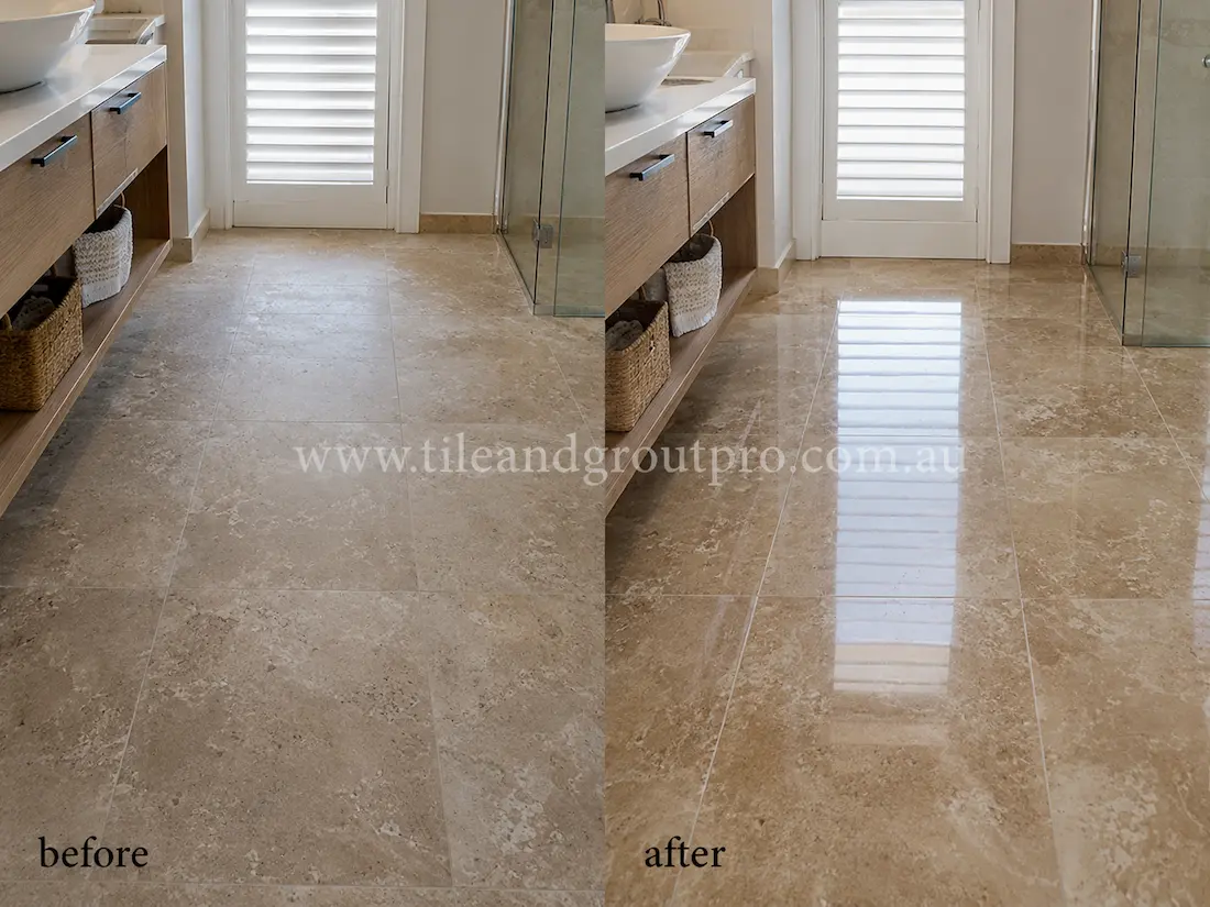 Before stone polishing, the beige travertine bathroom floor tiles looked hazy and worn with low reflectivity near the glass shower and timber vanity cabinets.