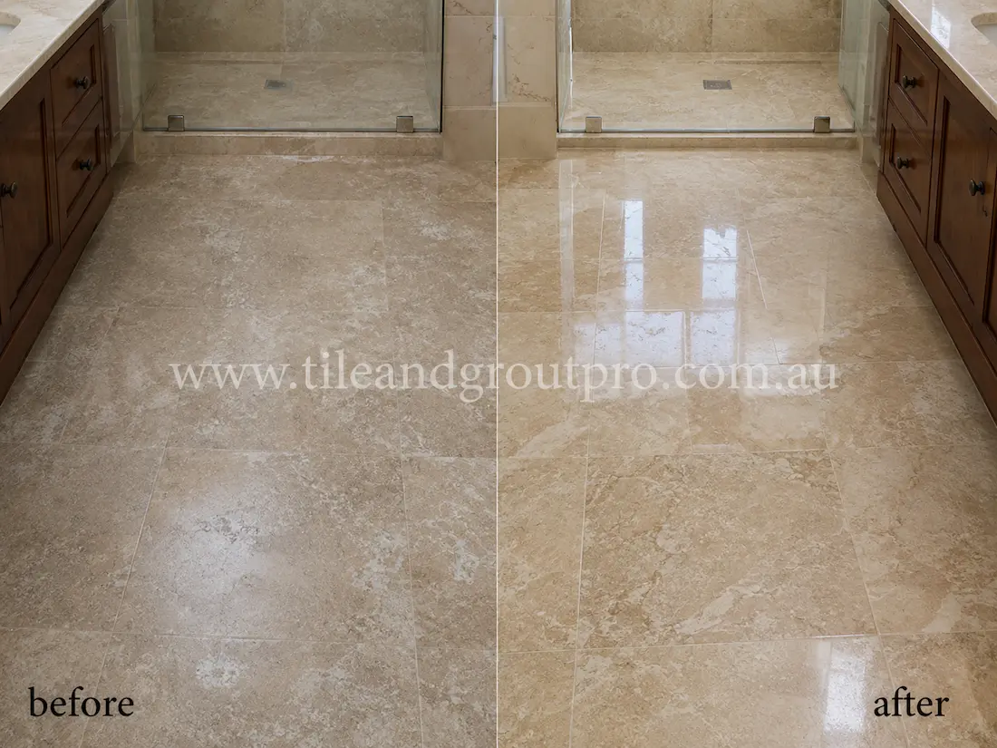 Before stone polishing, the beige travertine bathroom floor tiles appeared dull and lightly etched with low sheen in a modern bathroom with timber vanity, glass shower, and plantation shutters.