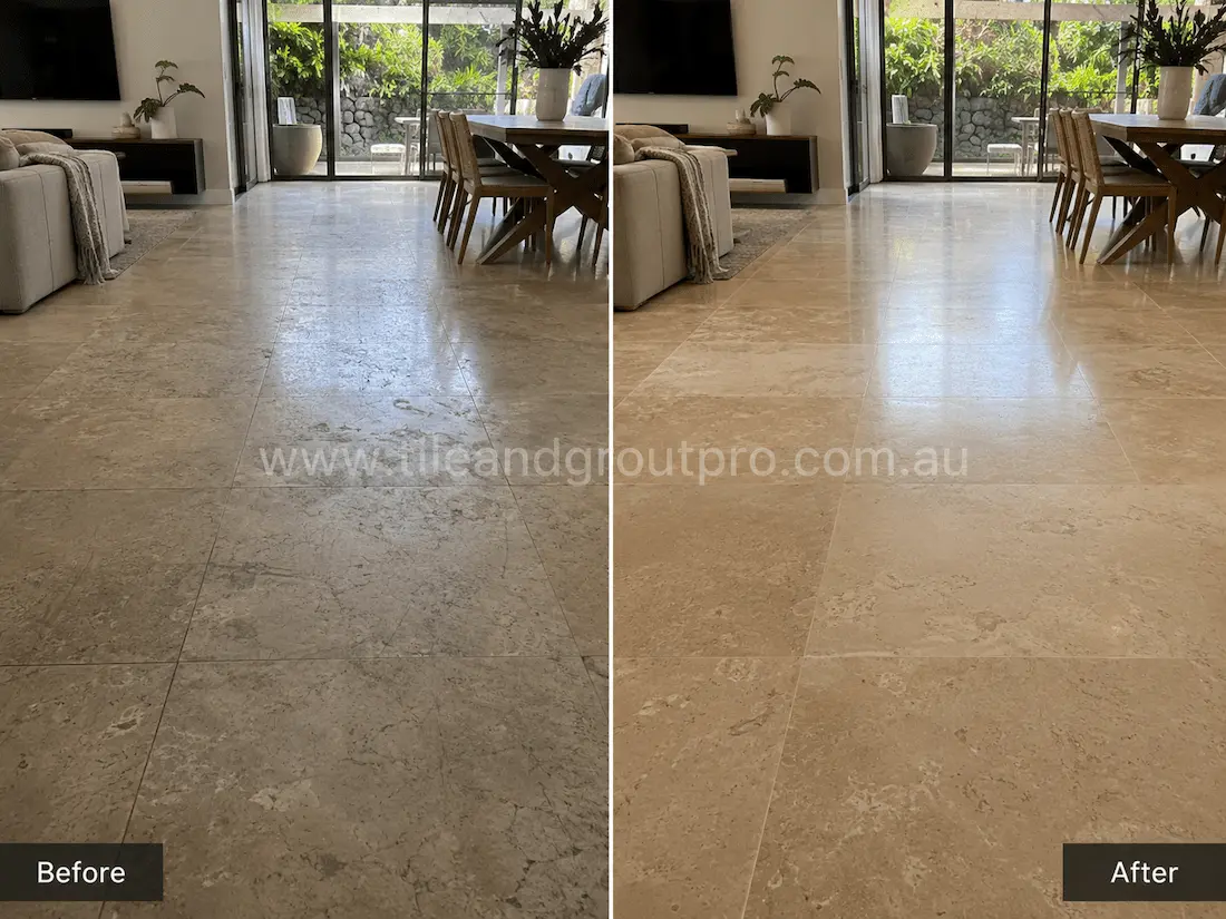 Open-plan living and dining area with travertine floor tiles displaying worn traffic paths, light etching, and a faded finish before tile resurfacing and polishing.