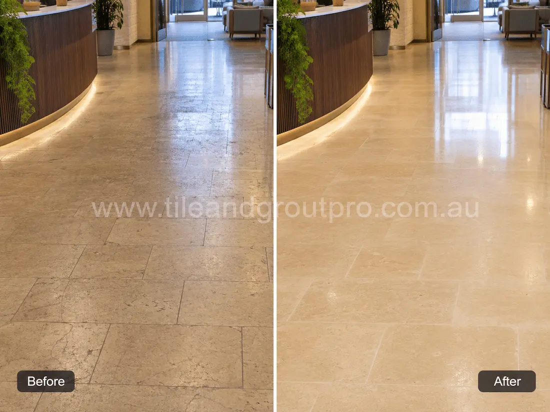 Commercial reception and lobby floor finished in travertine tiles with visible wear, scratches, and loss of sheen from heavy foot traffic before tile resurfacing.