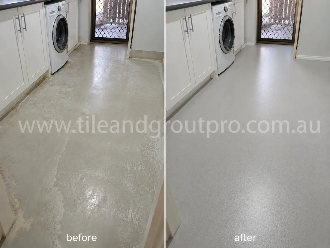 Residential laundry room vinyl flooring before sealer stripping, showing cloudy sealer build-up, peeling finish, and uneven surface coating near washing machine and cabinetry.